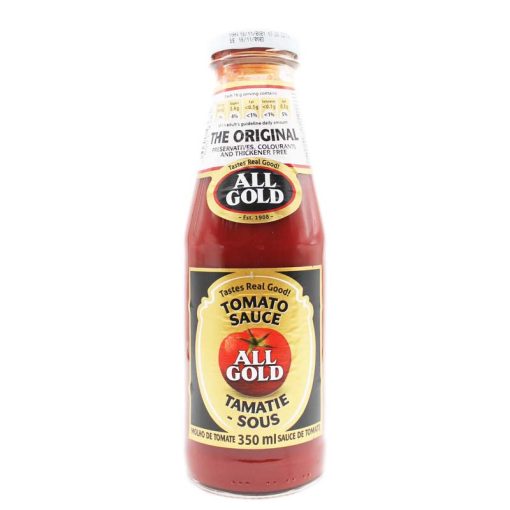 small bottle of all gold tomato sauce on white background